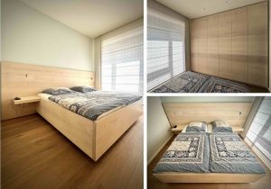 Dieses Schlafzimmer besteht aus einem Bett mit großer Rückenlehne und Nachttischen sowie einem wandfüllenden Schrank aus Esche. Damit das kleine Schlafzimmer durch die großen Holzflächen nicht zu beengt wirkt, haben wir die helle Esche mit weißpigmentiertem Öl veredelt. Um die sehr große Schrankfront etwas aufzulockern, hat sich unser Kunde einen Wechsel aus hellerem und dunkleren Holz gewünscht. Dadurch ergibt sich zusätzlich zum Fugenbild eine weitere Unterteilung der Ansicht des großen Einbauschrankes. Unter der Liegefläche kann weiterer Stauraum genutzt werden: die Lattenroste sind mit Gasdruckfedern ausgestattet.